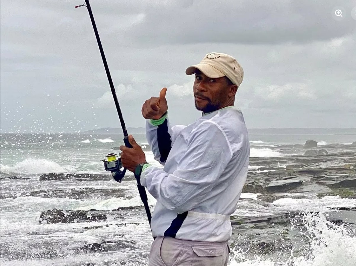 Angler casting a line from a Wild Coast beach
