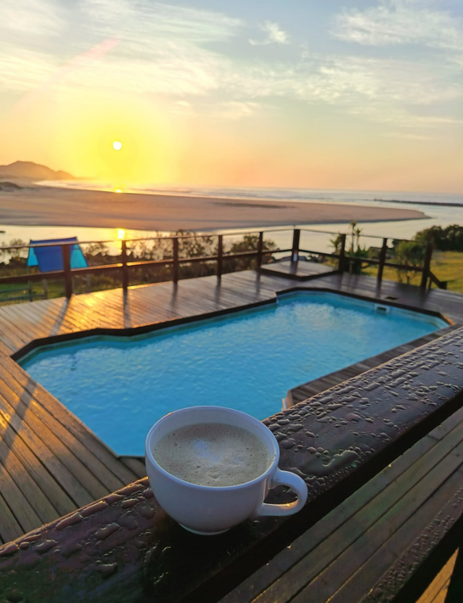 Sunset over the pool and deck at Wavecrest